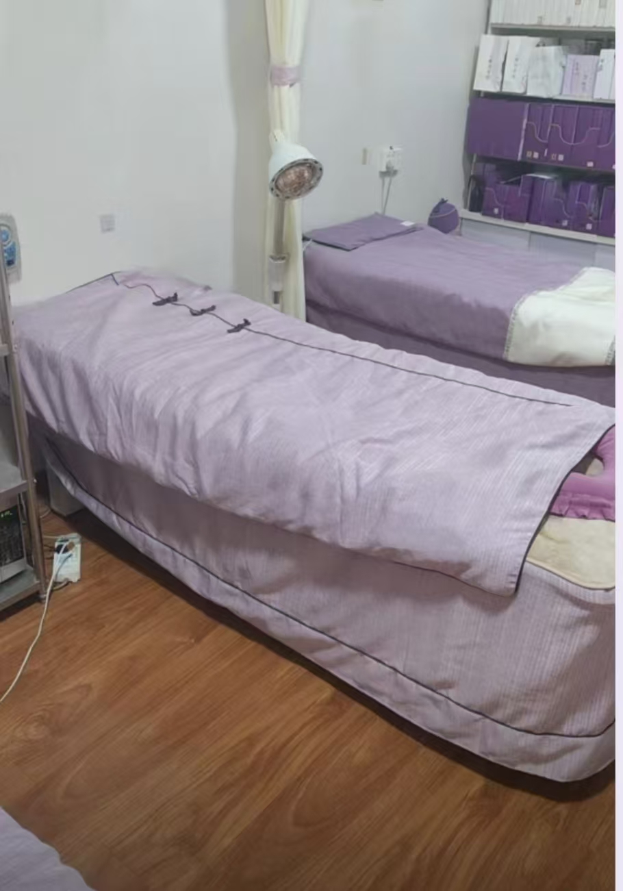 Purple treatment beds inside the wellness studio